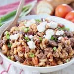 Ground lamb pasta in bowl with spoon